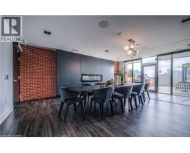 A dining room with a long table and chairs.