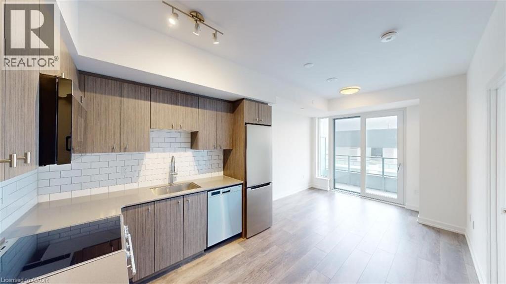 A modern kitchen with wooden cabinets and a large island.