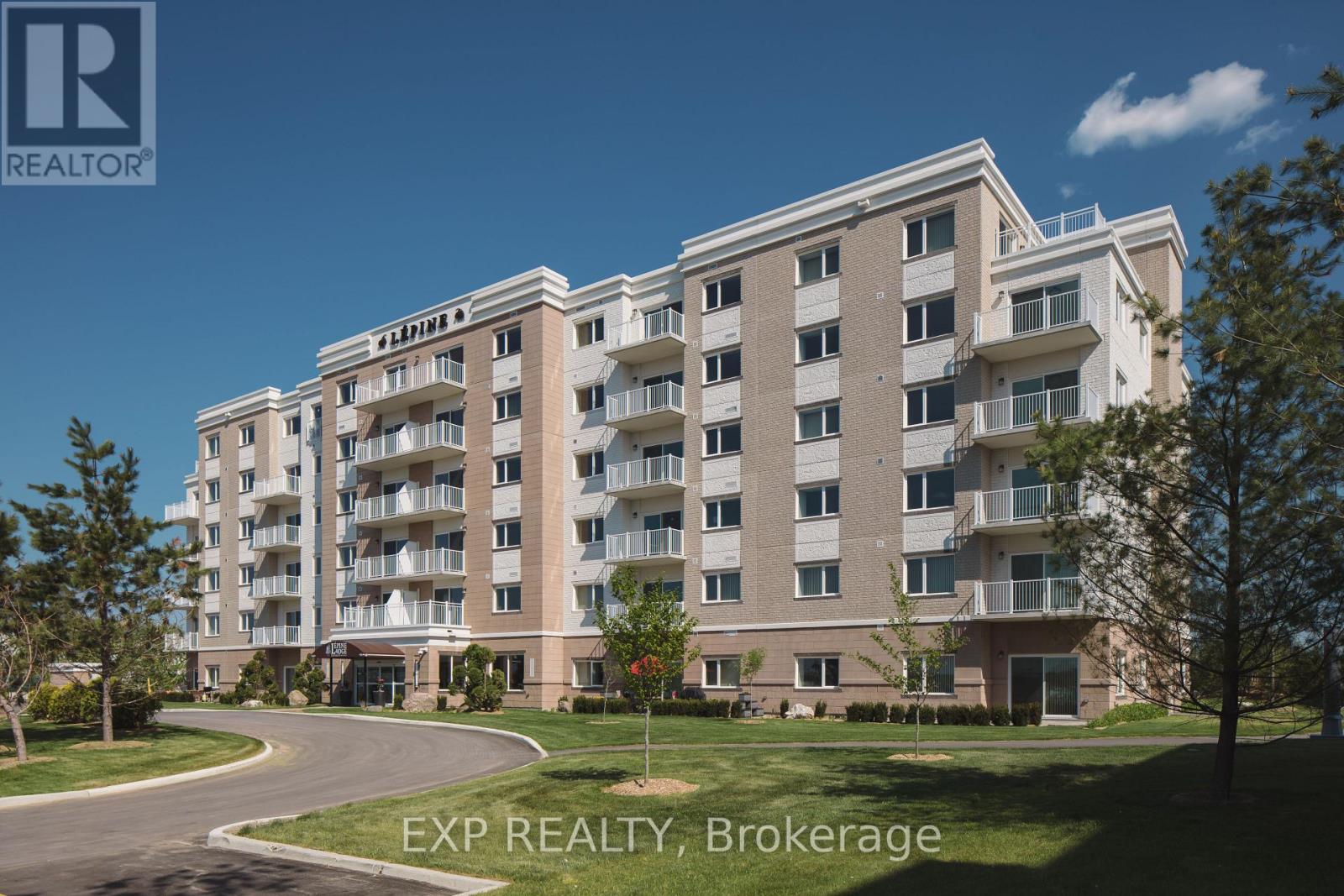 A large apartment building with a clear blue sky in the background.
