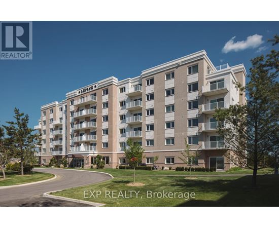 A large apartment building with a clear blue sky in the background.