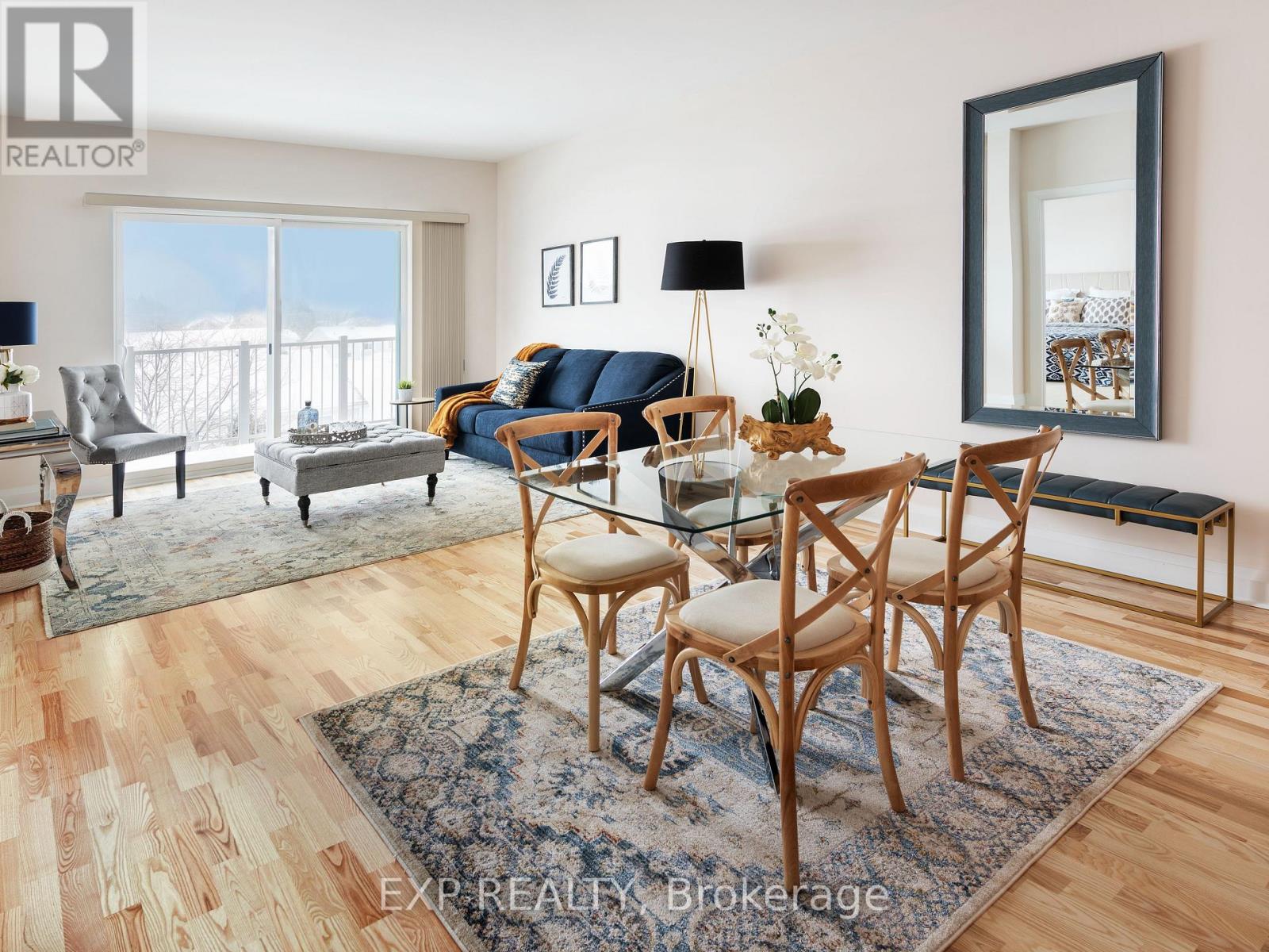 A living room with a glass table and chairs.