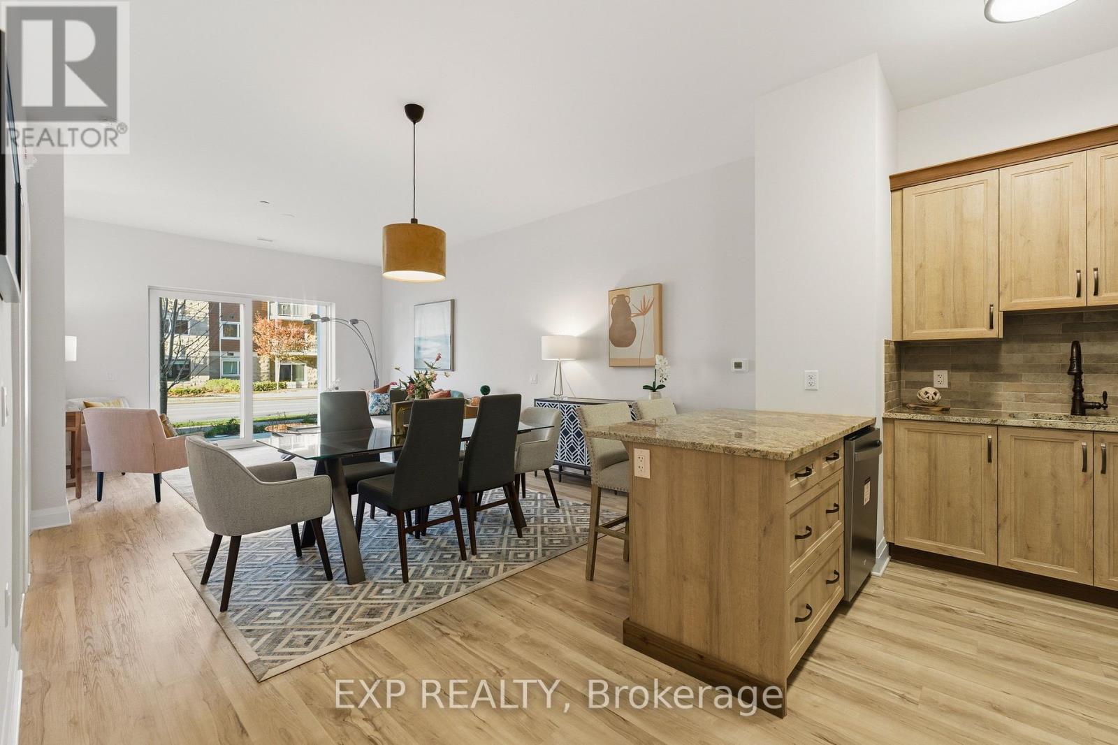 A modern kitchen with wooden cabinets and a dining table with chairs.