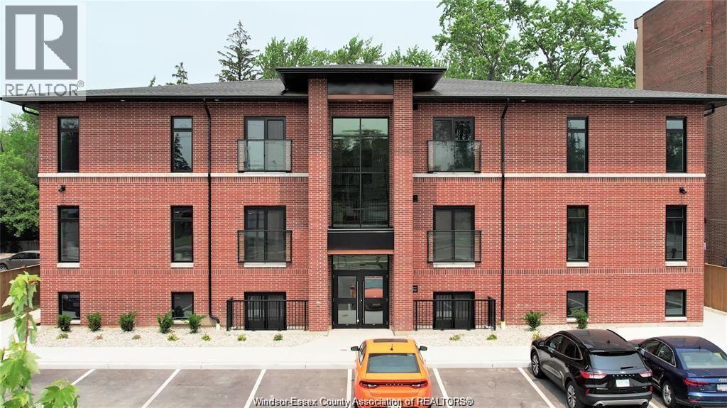 A building with a parking lot in front of it.