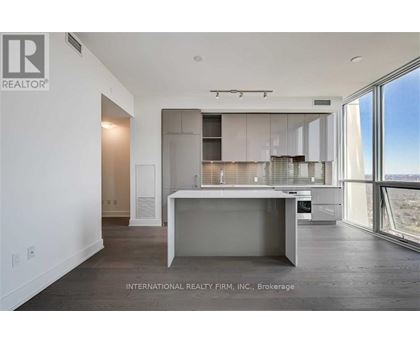 A modern kitchen with a large island in the middle.