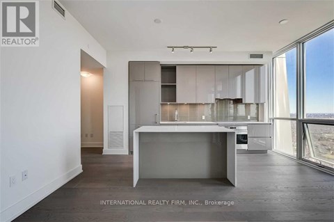 A modern kitchen with a large island in the middle.