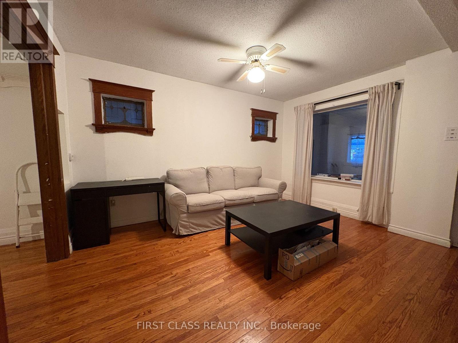 A living room with a couch, chair, and coffee table.