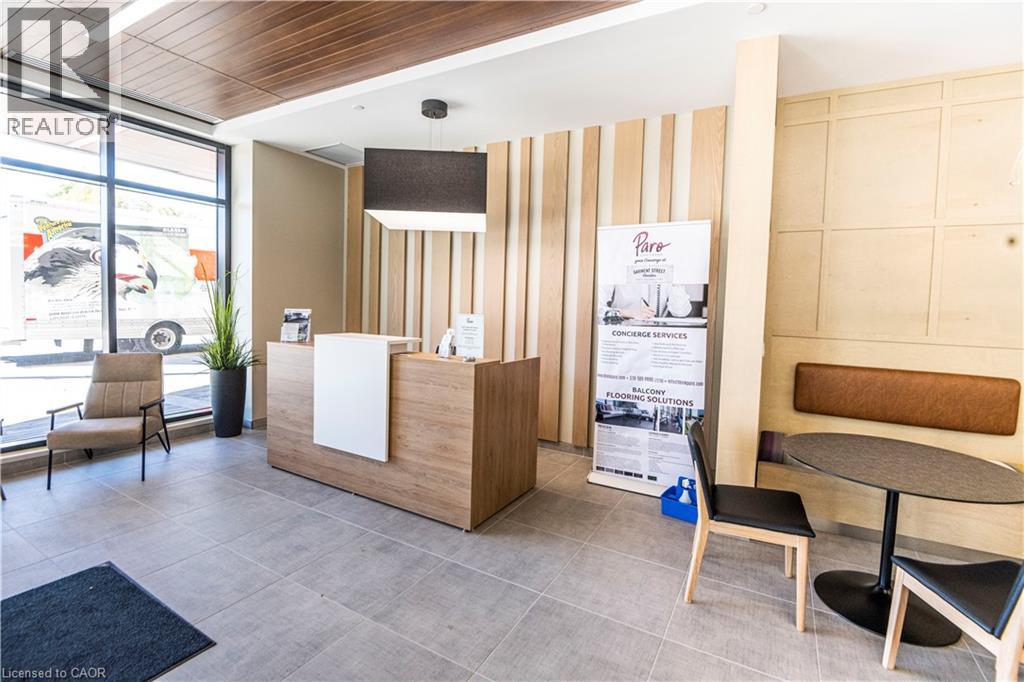 A realtor's office with a wooden reception desk and chairs.