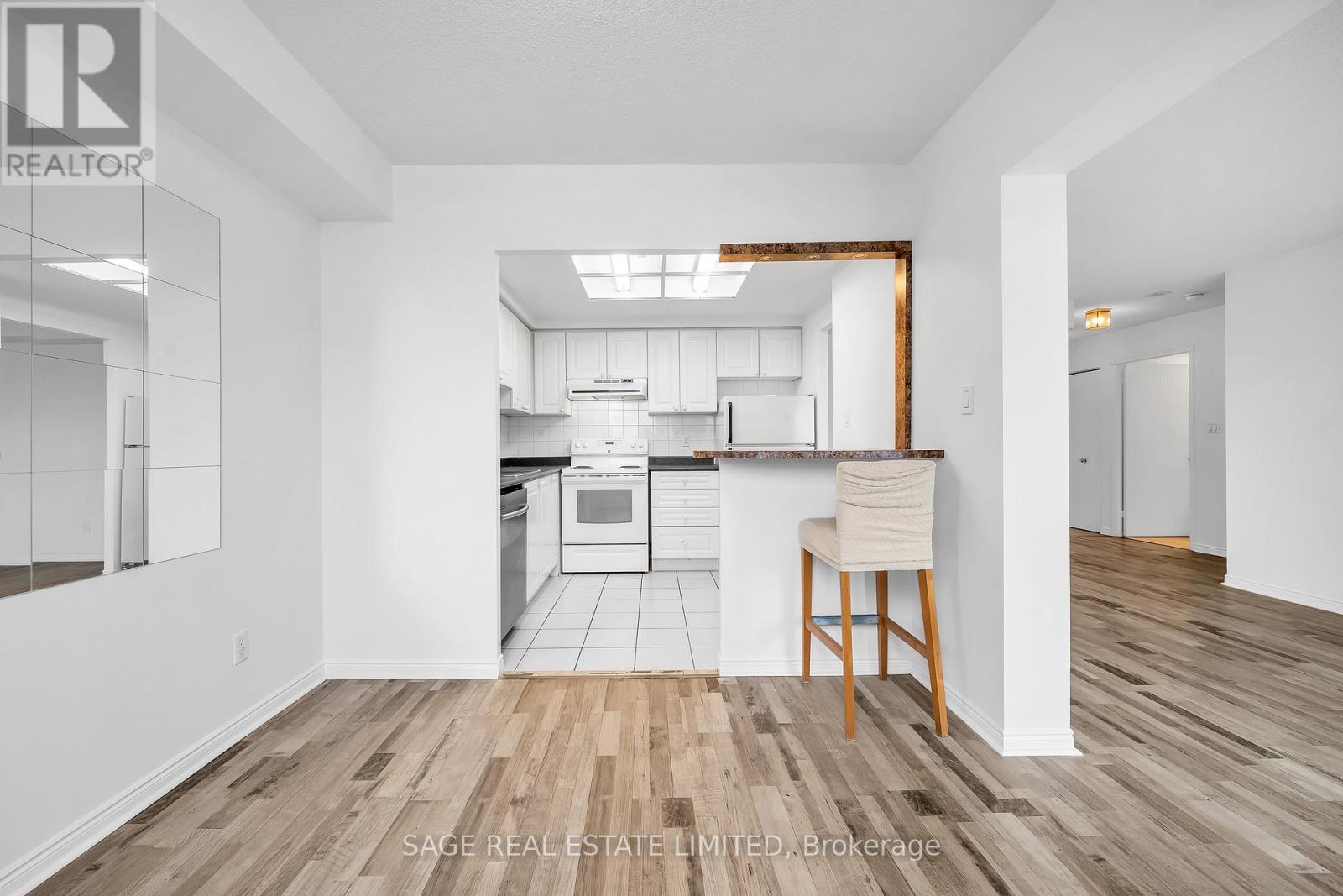 A realtor photo of a kitchen with a dining area.