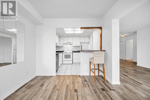 A realtor photo of a kitchen with a dining area.