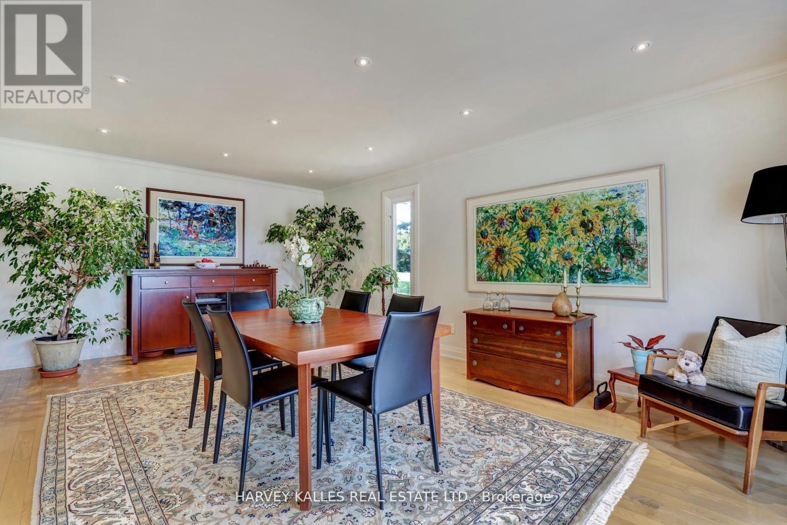 A dining room with a table set for four.