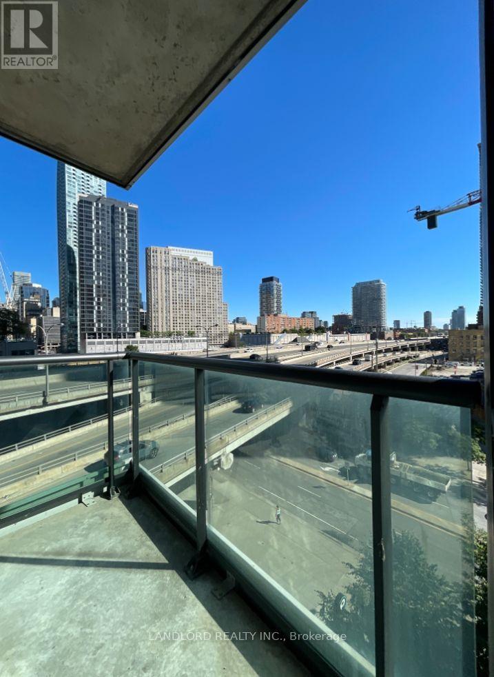 A view from a high-rise building looking out over a busy highway and cityscape.