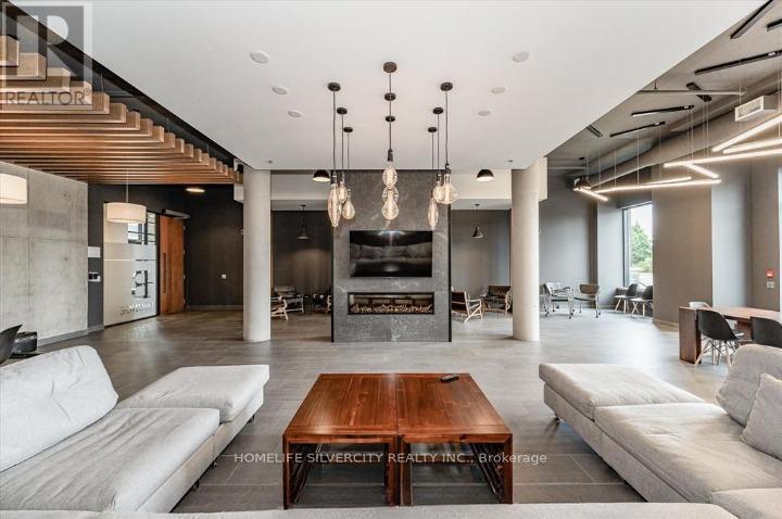 A modern living room with a wooden coffee table and white sofas.