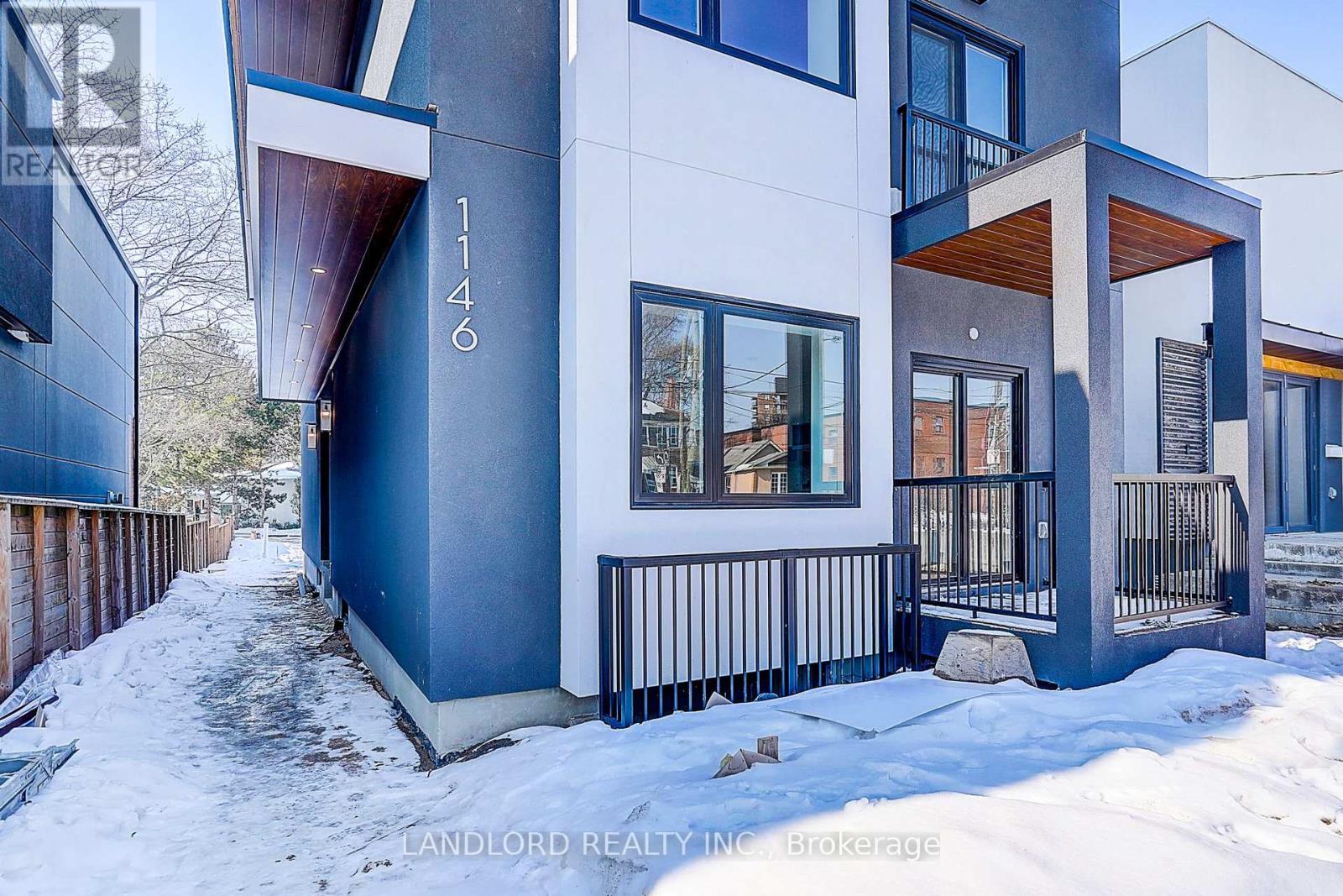 A modern house with the number 1146 on it.