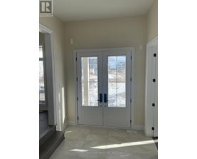 A white double door with a glass window in the middle.
