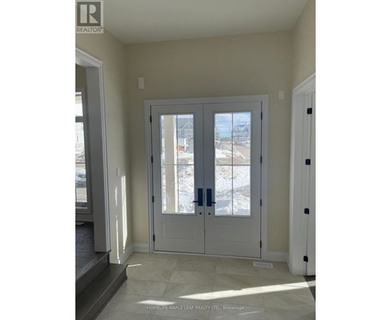 A white double door with a glass window in the middle.