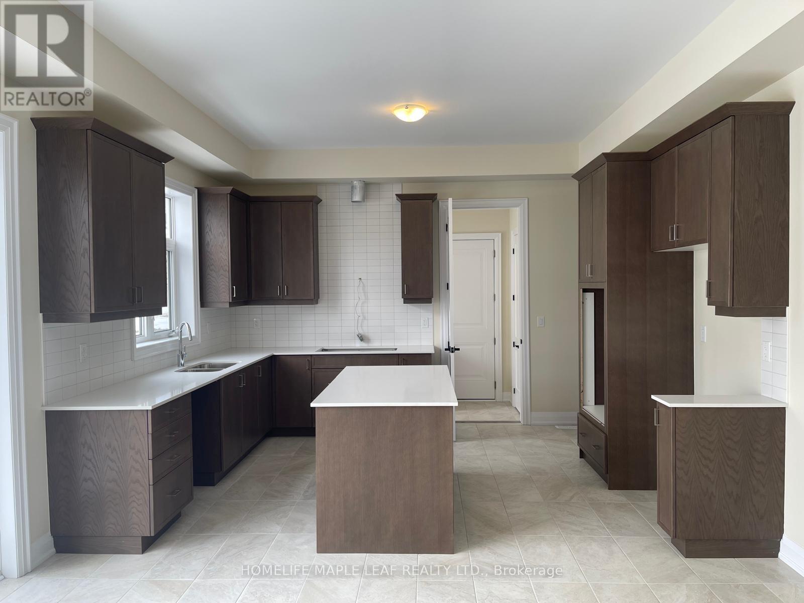 A kitchen with brown cabinets and a white countertop.