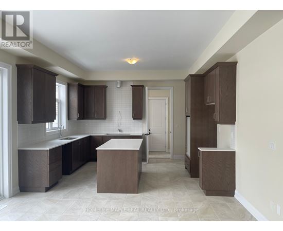 A kitchen with brown cabinets and a white countertop.