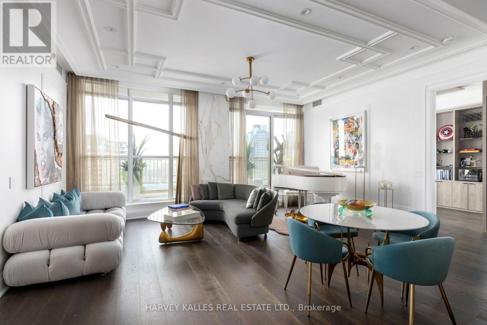 A well-lit, spacious living room with a dining table and chairs.
