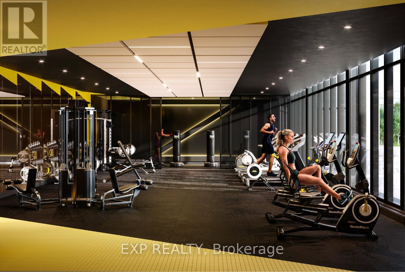 A woman is working out on a rowing machine in a gym.