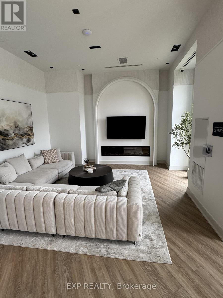 A living room with a large couch and a television.