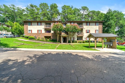 our apartments are located in a quiet neighborhood with green grass and trees