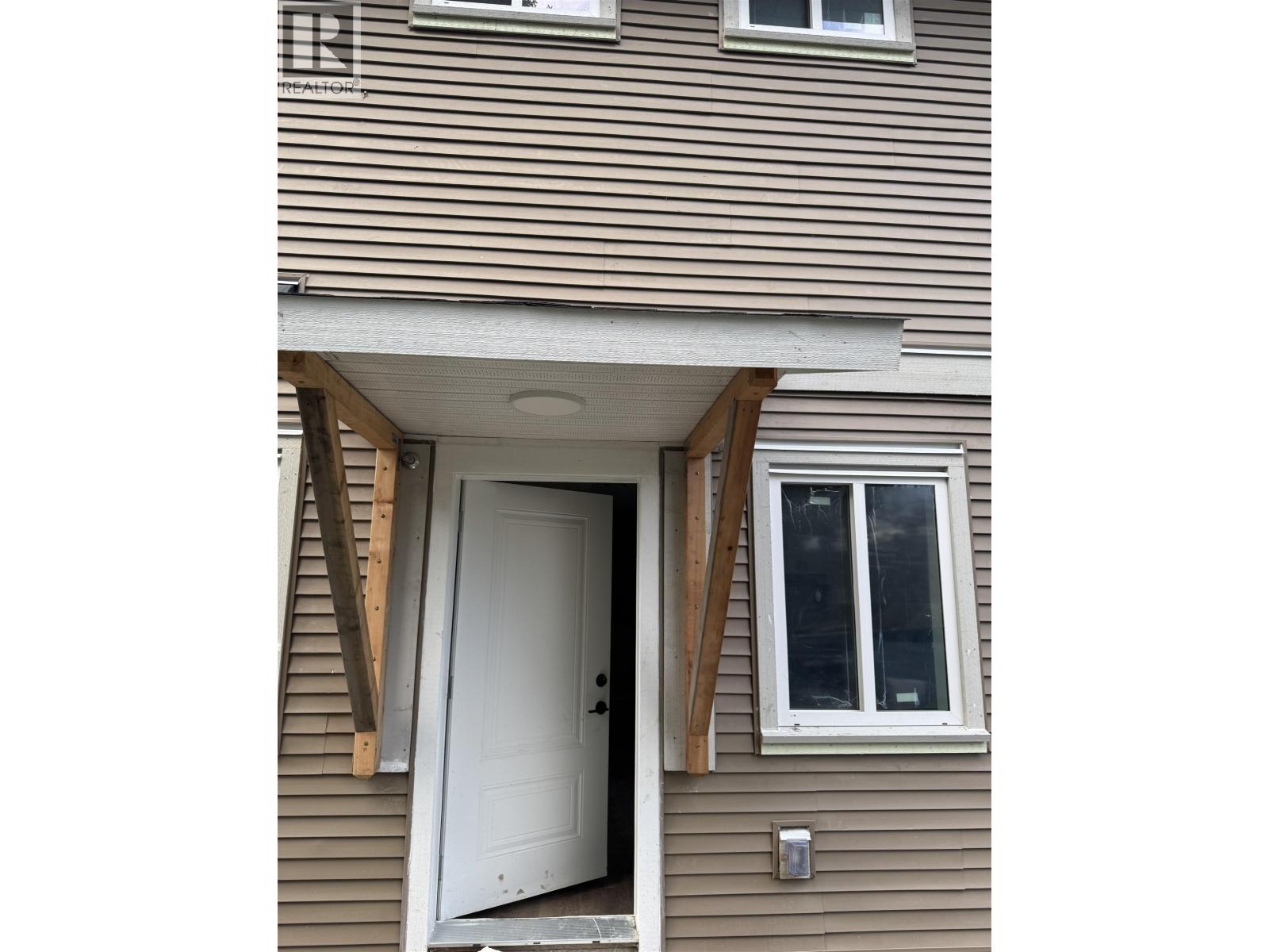 A house with a door and window is shown.