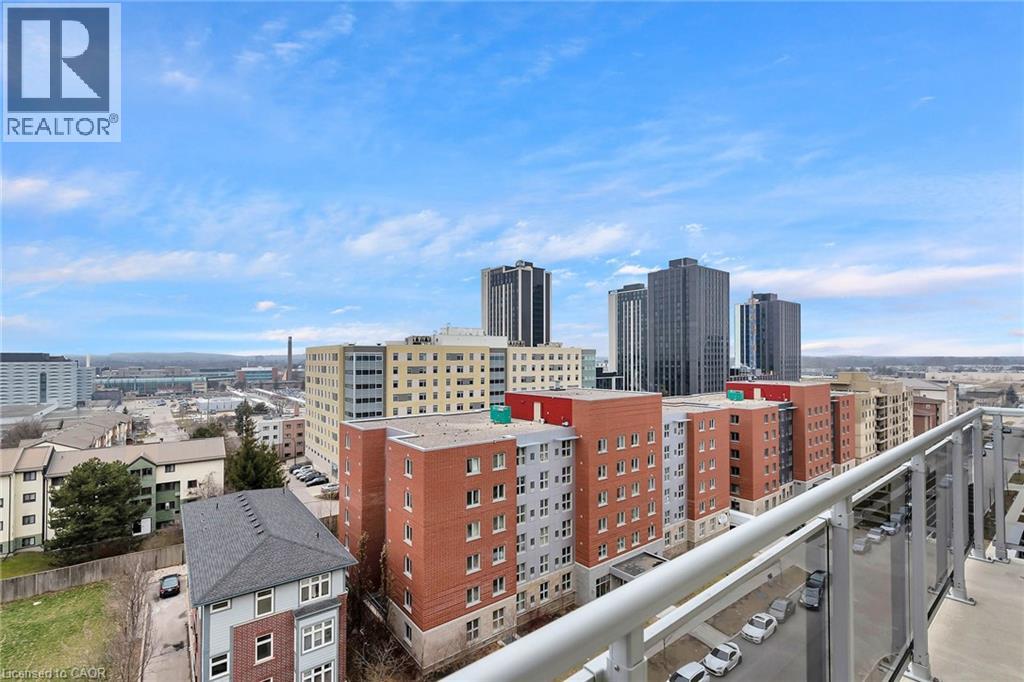 A cityscape with a bridge in the foreground and buildings of various heights in the background.