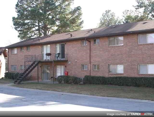 a brick apartment building with a fire escape