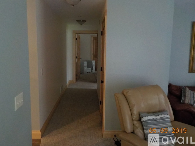 A living room with a couch and a chair.