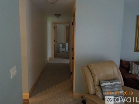 A living room with a couch and a chair.