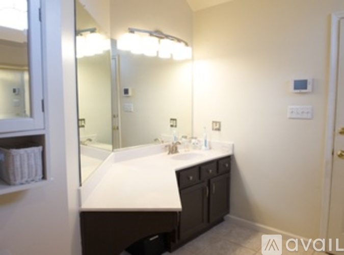 A bathroom with a vanity and a mirror.
