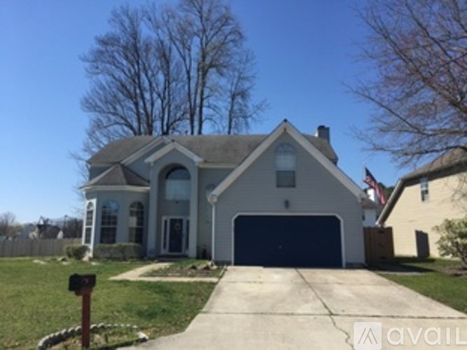 A house with a garage is for sale.
