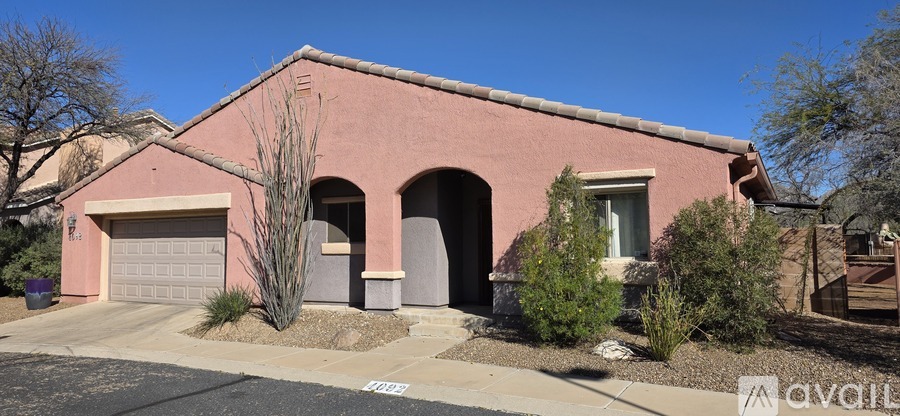 A house with a garage is for sale.