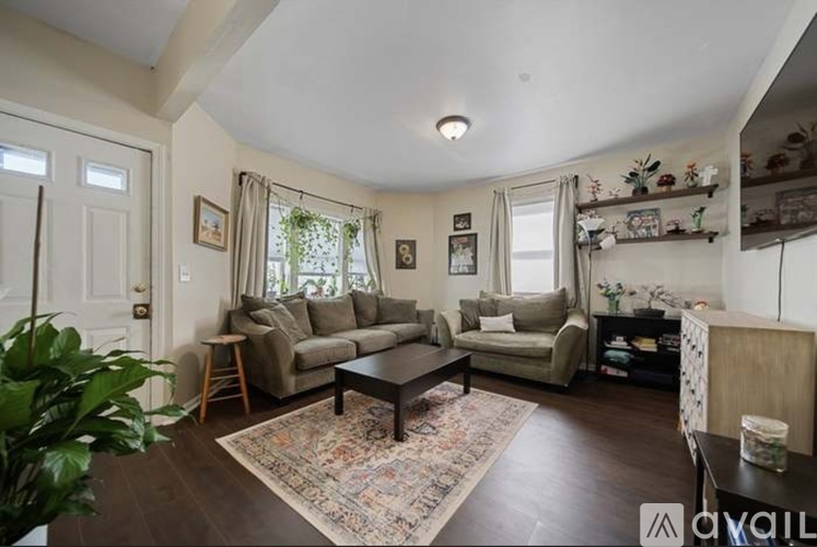A living room with a couch, chair, and coffee table.