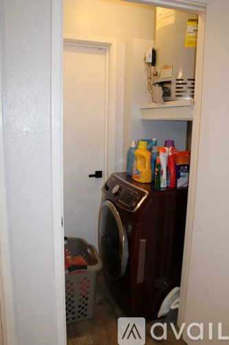A small laundry room with a washer and dryer.