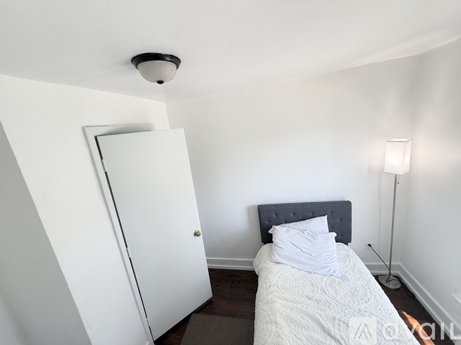 A room with wooden floors and a window.