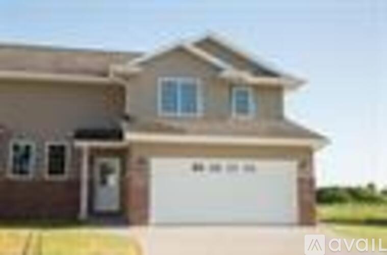 A house with a garage is available for sale.