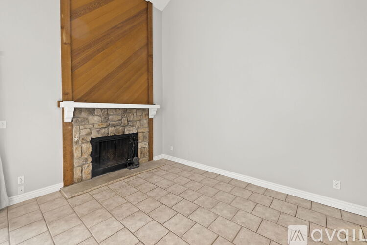 A room with a fireplace and a wooden door.
