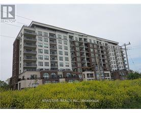 A large, multi-story building with a balcony on the second floor.