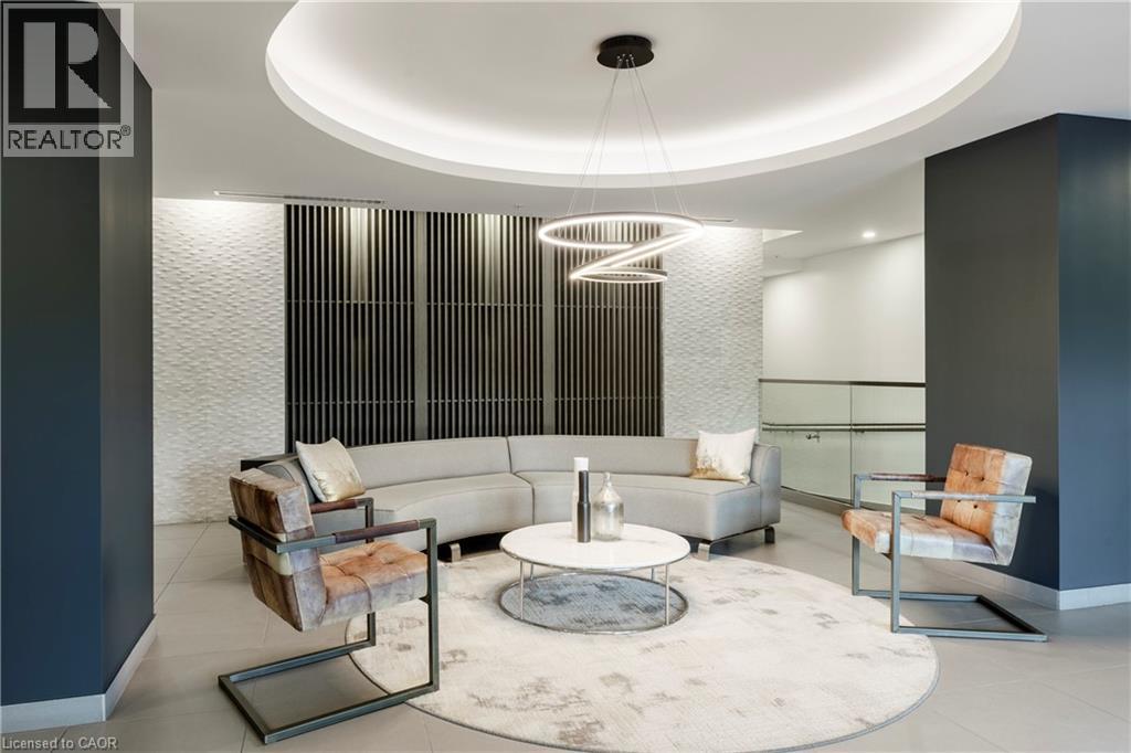 A modern living room with a grey and white color scheme.