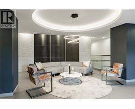 A modern living room with a grey and white color scheme.