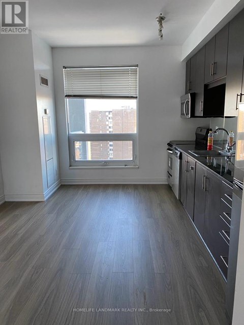 A kitchen with a window and a sink.