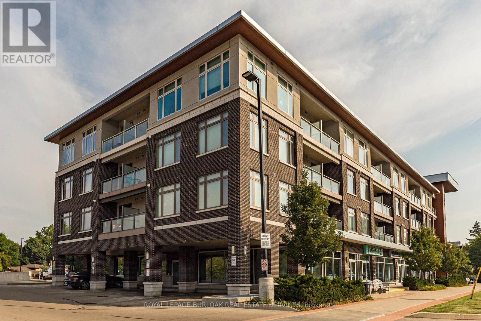 A large brick building with a balcony on the second floor.