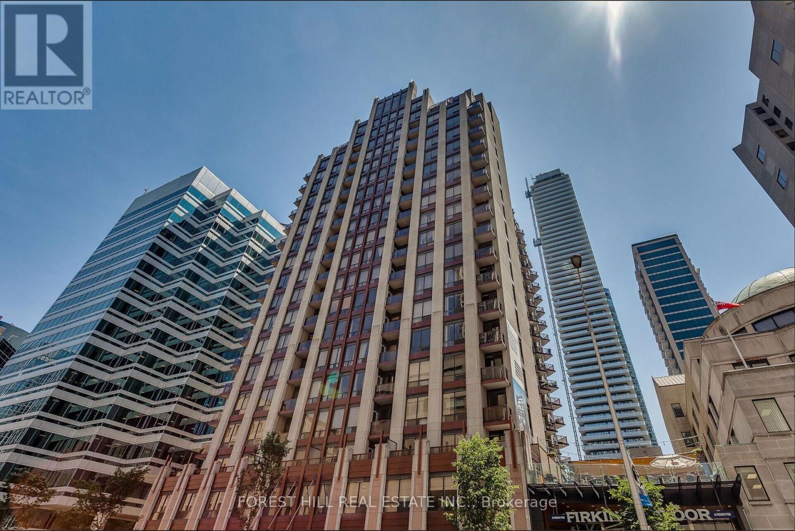 A tall building with a sign that reads "REALTOR" on the top left corner.