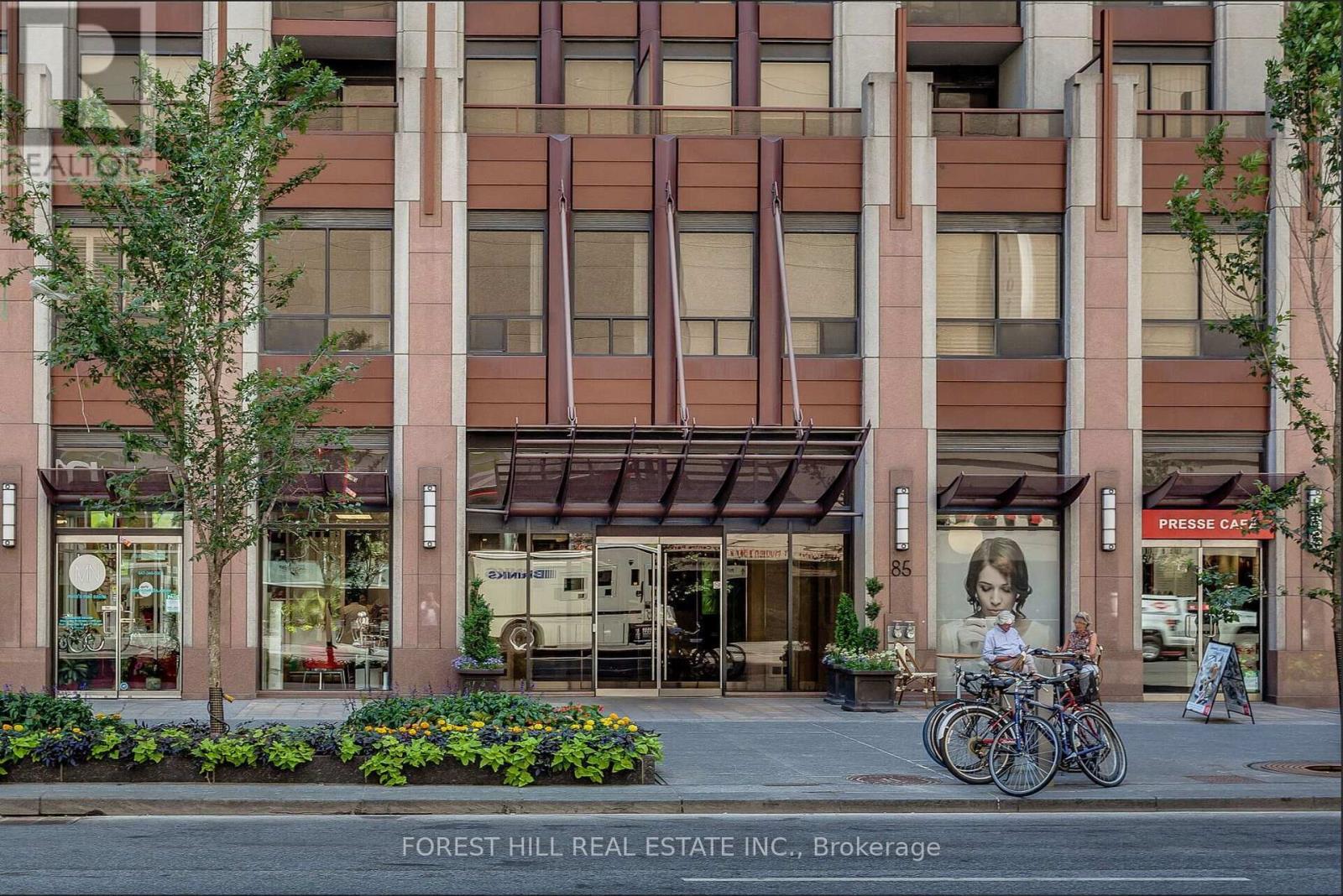A building with the words "FOREST HILL REAL ESTATE INC., BROKERAGE" written on the bottom.