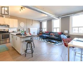 A kitchen with a bar stool and a countertop with a sink.