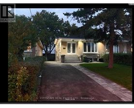 A house is shown with a driveway in front of it.