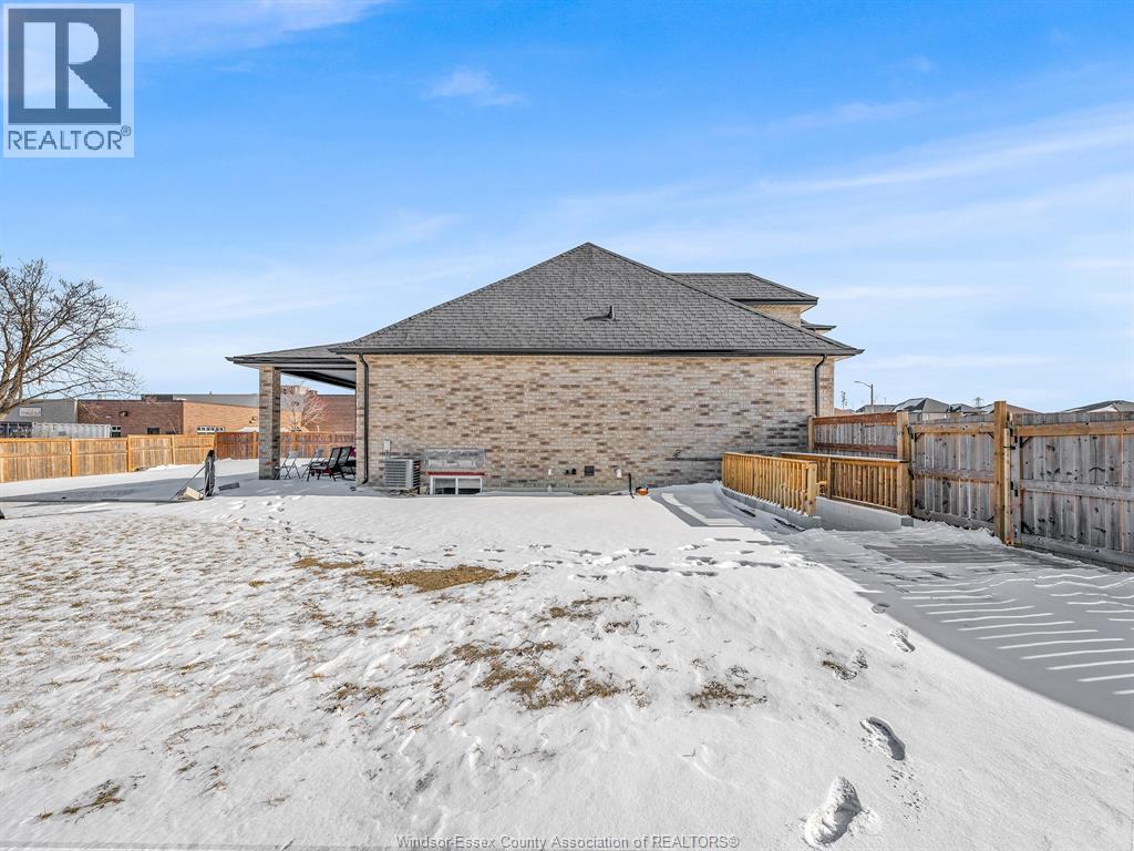 A building with a snowy ground in front of it.