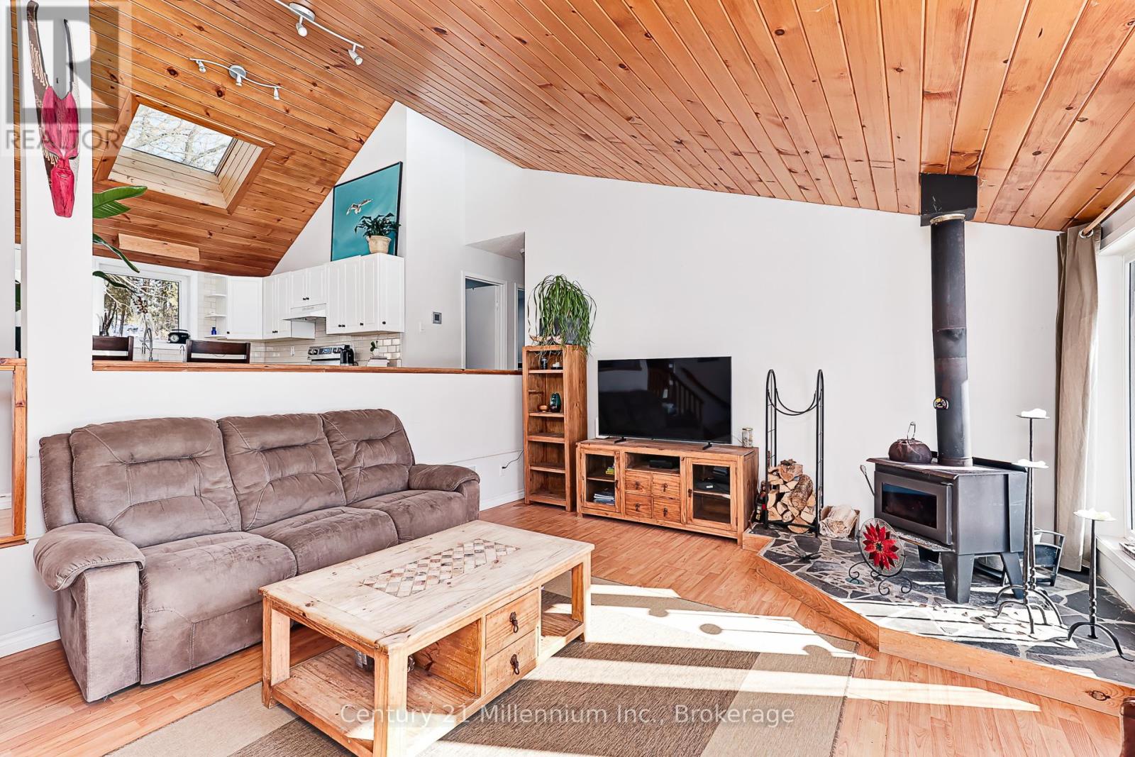 A living room with a grey sofa and wooden coffee table.