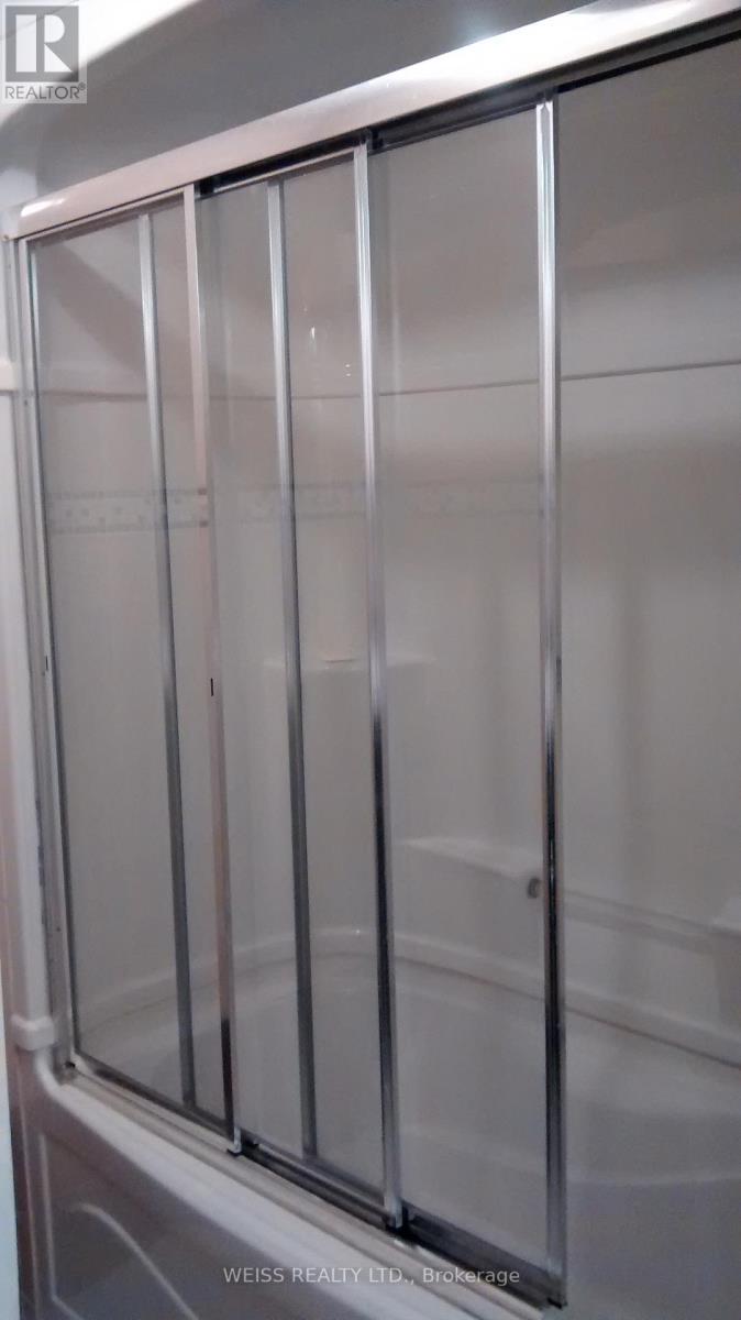 A stainless steel refrigerator with a glass door.